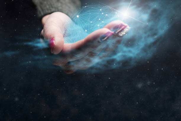 istock Woman holding in palm Social connection technologies. Nebula dust. Mixed media. 1126621801