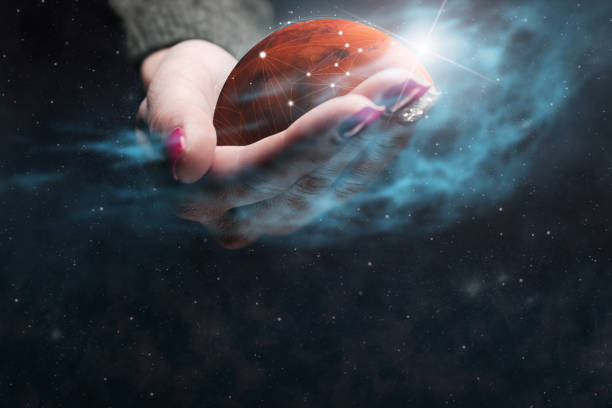 istock Woman holding New Home Mars. Nebula dust. Mixed media. 1126621814