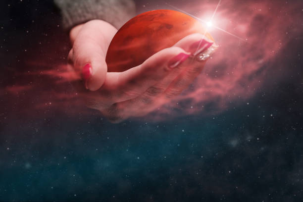 istock Woman holding New Home Mars. Nebula dust. Mixed media. 1126622378