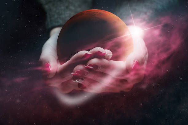istock Woman hand hold New Home Mars. Red Nebula dust. Mixed media. 1126622411