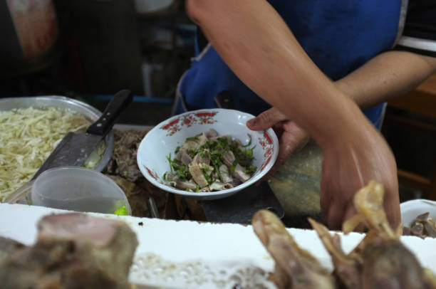 istock Chef cooking noodle with pork and pork entrails 1126622474