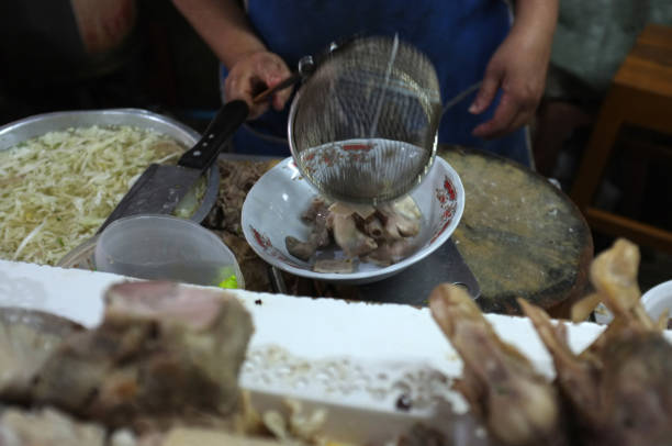 istock Chef cooking noodle with pork and pork entrails 1126622603