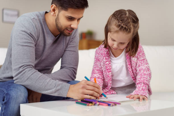 istock Young father teaching his little daughter 1126622794