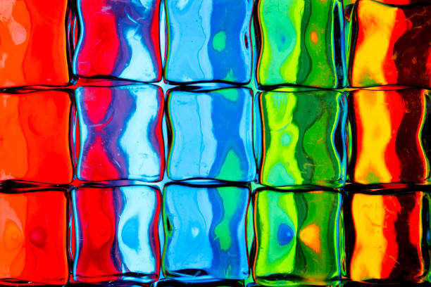 A brightly colored image distorted through a square glass block / brick  wall / window