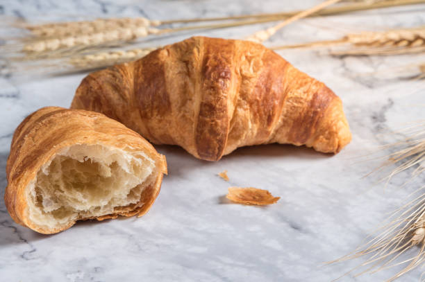 istock French delicious croissants on light background 1126626743