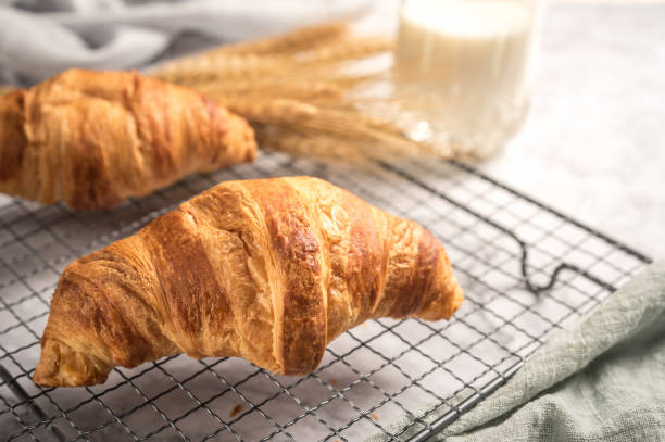 istock French delicious croissants on light background 1126626791