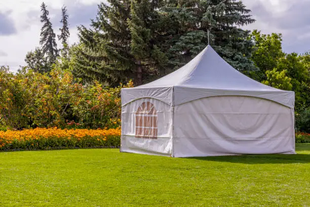 Party tent - white garden party or wedding entertainment tent in a modern garden