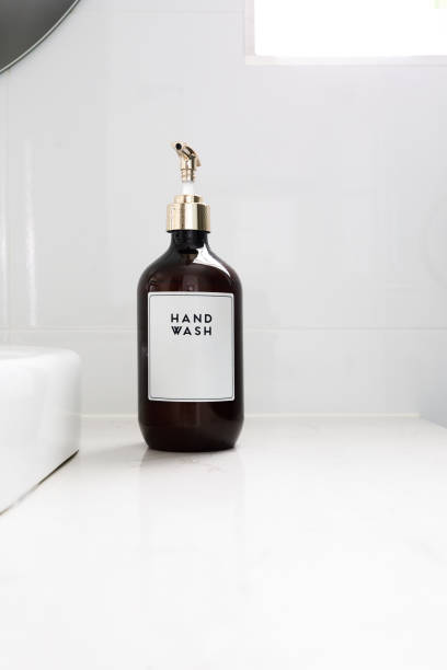 Hand Wash Dispenser In Luxury White Bathroom - Home Decor Hand Wash Dispenser In Luxury White Bathroom - Home Decor / Decoration guest bathroom stock pictures, royalty-free photos & images