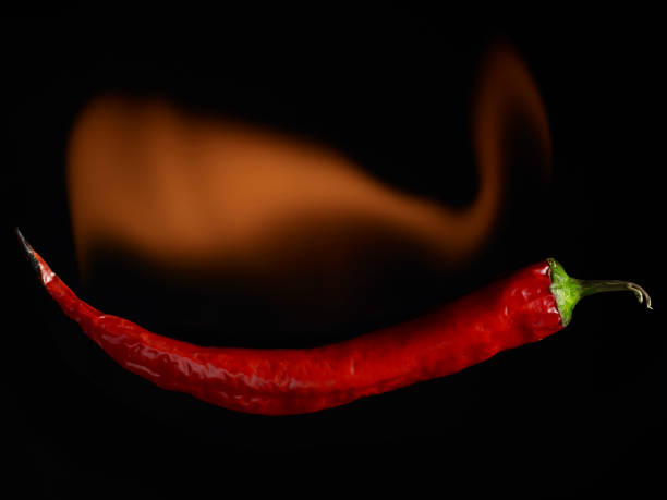 istock Flaming Hot Pepper on a black background 1126627266