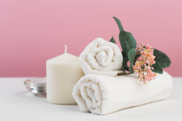 istock Spa still life with aromatic candles, flower and towel. - Image 1126628249