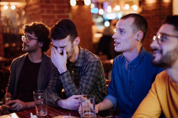 istock Friends Watching Game In Sports Bar 1126630636