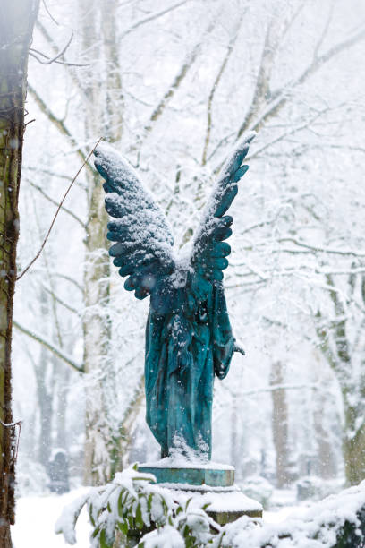 istock Antique Angel Statue on a Graveyard 1126631864