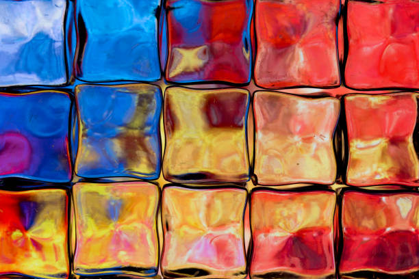 istock Abstract textured background of a multi-colored glass block wall 1126632440