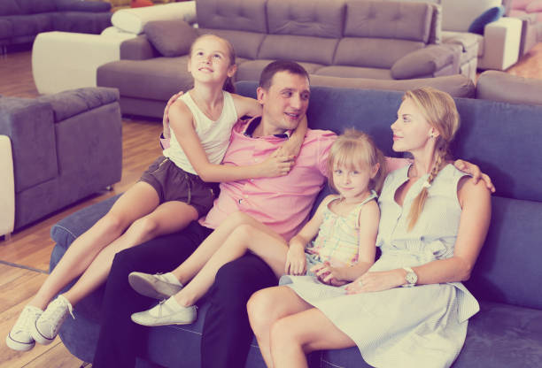 istock Family is satisfied by new bought sofa 1126633168