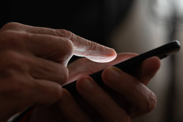 istock Man typing on a black smartphone 1126633197