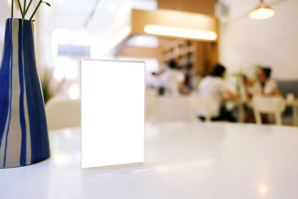 istock Menu frame standing on wood table in Bar restaurant cafe. space for text marketing promotion. 1126634537