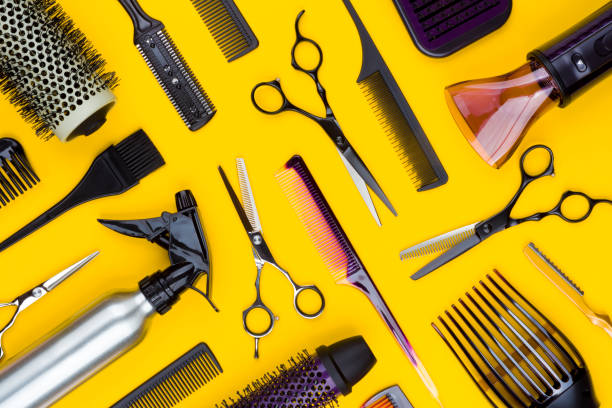 istock Hairdresser tools and combs tools on yellow background, top view 1126635967