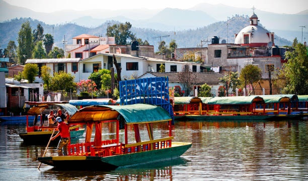 Dozens of typical and characteristic Trajinera boats moored on Lake Xochimilco south of Mexico City stock photo