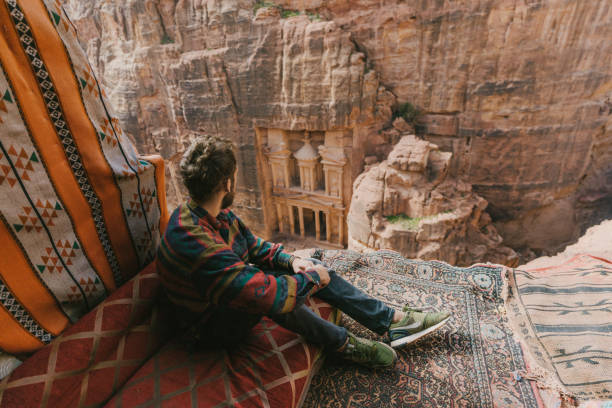 istock Man  looking at Al-Khazneh in Petra 1126637853