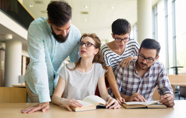 istock Group of young students studying together 1126638655