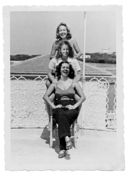 Three young smiling women at the beach in 1938 Three young smiling women at the beach in 1938 archival photos stock pictures, royalty-free photos & images