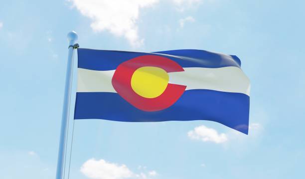 istock Colorado (USA) flag waving against blue sky 1126640274