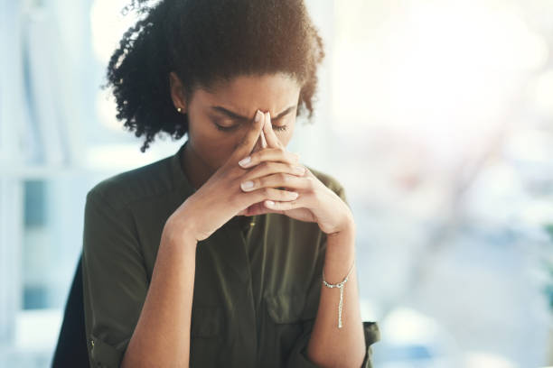 It's always stressful when critical matters are beyond your control Shot of a young businesswoman looking overly stressed in her office managing stress stock pictures, royalty-free photos & images