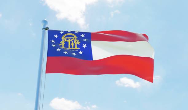 istock Georgia (USA) flag waving against blue sky 1126642113