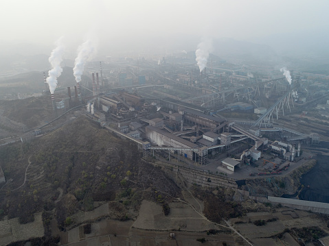 Air pollution by smoke coming out of chimneys. Coal Fossil Fuel Power Plant Smokestacks  Emit Carbon Dioxide Pollution. Chengde, China.