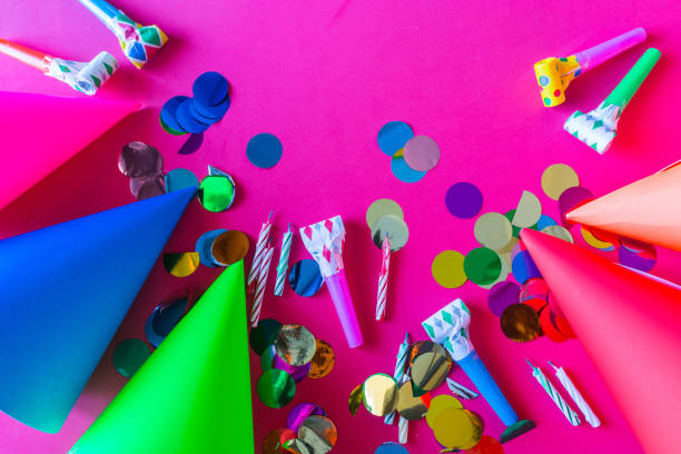 istock birthday celebration with paper hats. 1126643250