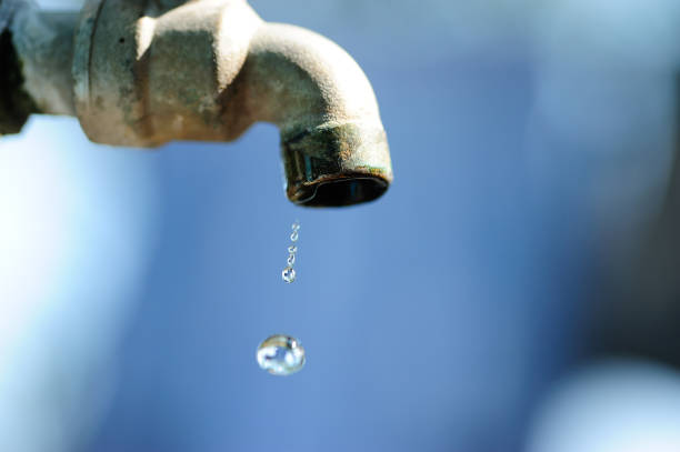 istock water drop and old faucet, shortage concept 1126643309