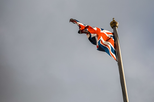UK flag flying over Buckingham Palace