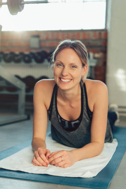 istock Relaxed natural young woman in a gym 1126645545