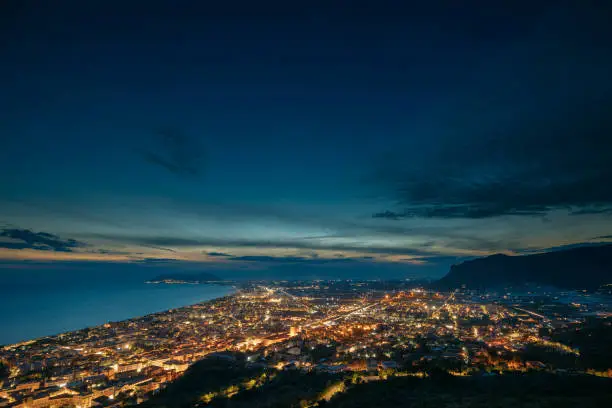 Terracina, Italy. Top View Skyline Cityscape City In Night Illuminations.