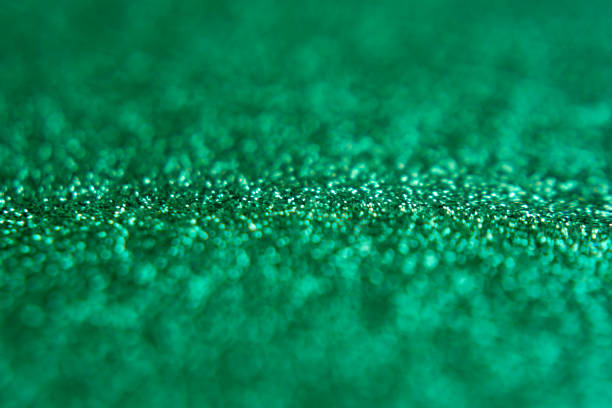 istock festive blurred bokeh background with glittering elements in green, 1126648796