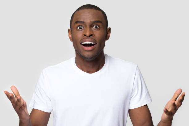 istock Amazed african-american man feeling excited by surprise looking at camera 1126648997