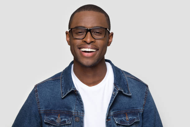 istock Smiling confident african man looking at camera isolated on background 1126649000