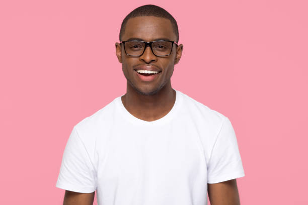istock Happy african man looking at camera isolated on pink background 1126649024