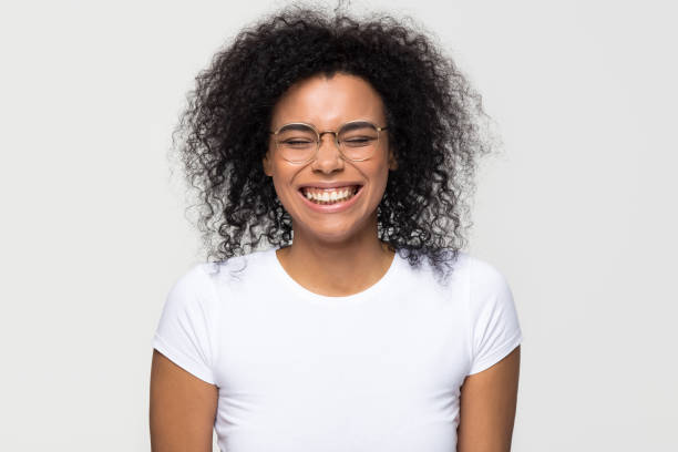 istock Funny african woman laughing isolated on white grey studio background 1126649046