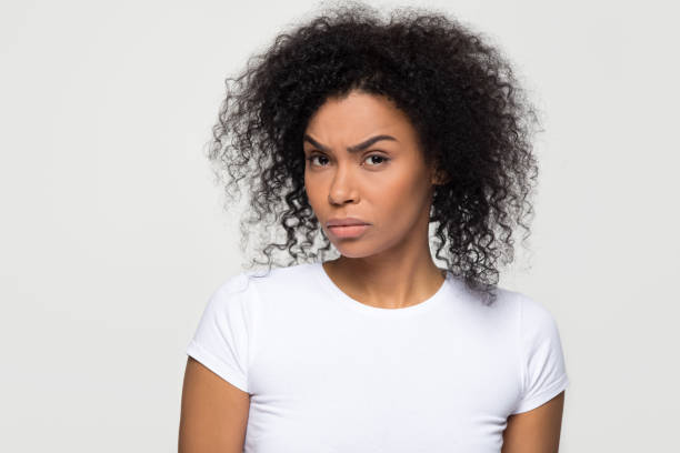 istock Suspicious african woman with distrustful face looking at camera 1126649061