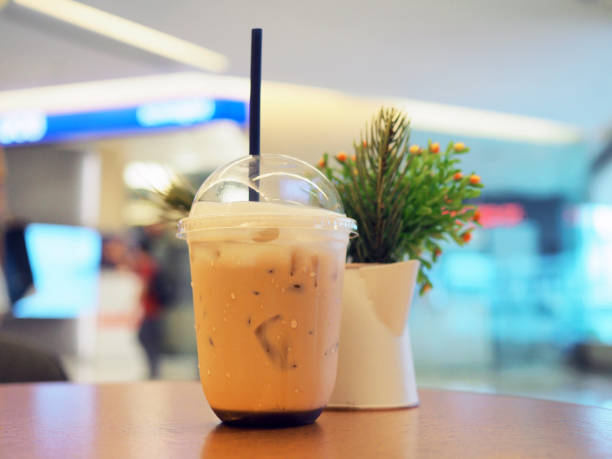 istock A plastic glass of refreshing Taiwan iced milk tea with bubble (boba) on table background. 1126651258