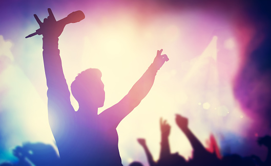 Excited singer raising hands on stage. Concert, musical gig. Entertainment, music industry. 3D illustration.