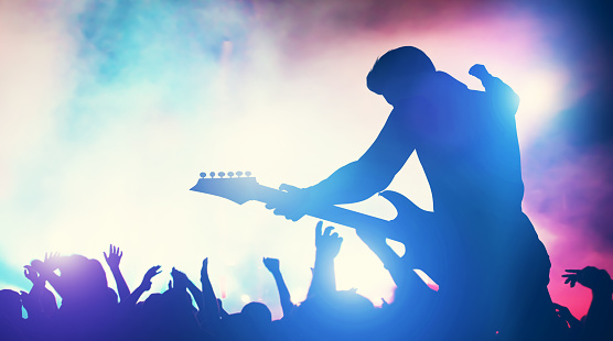 Man performing on music concert. Cheering crowd, fans, entertainment. Music industry. 3D illustration.