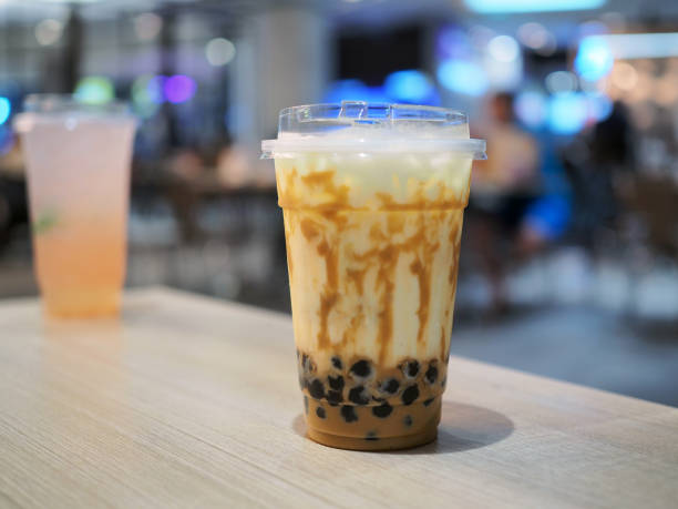 istock A plastic glass of refreshing iced fresh milk tea with bubble (boba) and brown sugar on table. 1126651664
