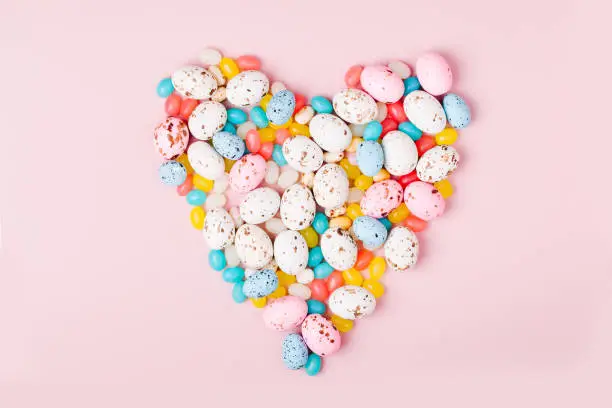 A beautiful heart made of  Easter candy chocolate eggs and Jellybean