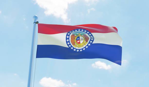istock Missouri (USA) flag waving against blue sky 1126655342