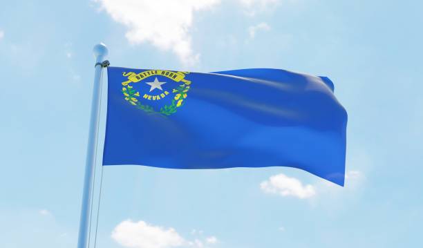 istock Nevada (USA) flag waving against blue sky 1126656062