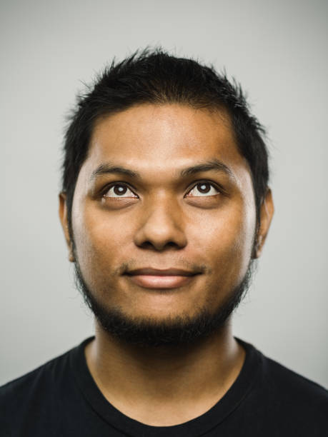 istock Real malaysian young man with relaxed expression looking up 1126656962