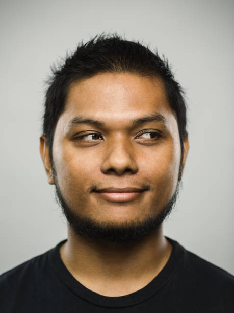 istock Real malaysian young man with happy expression looking to the side 1126656988