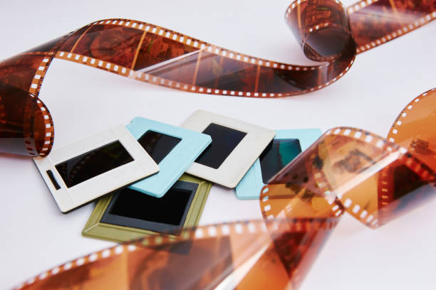 film and slides film and slides on a white background, in a beautiful composition film negative photos stock pictures, royalty-free photos & images